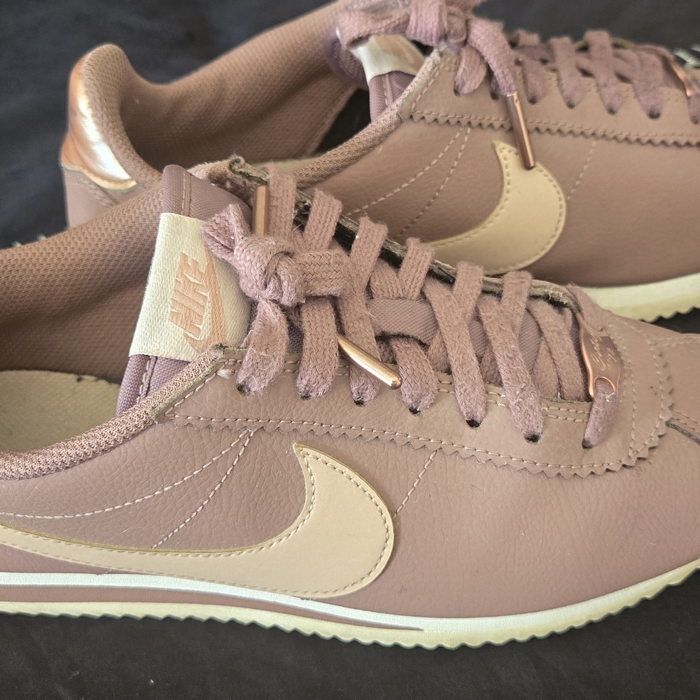 Nike Pink and Cream Sneakers for Everyday Style
